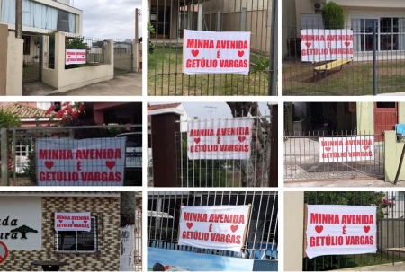 Moradores e empresários da Avenida Getúlio Vargas colaram cartazes e adesivos em protesto a troca de nome da rua